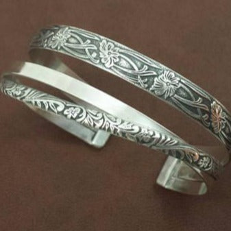 CROSSOVER CUFFS have three patterns of sterling silver, each gently crossing over and through the others to form a unique cuff bracelet. This is the perfect companion for our submissive collars. THIS LISTING IS made with the Soft and Sweet and Colleen floral patterns with smooth sterling rectangle wire.