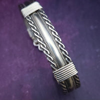 Bold, dramatic and luxurious, this KEY KEEPER BRACELETS is from our BABYLON COLLECTION. A detachable chain safely holds the key to Your submissive's lock.  Lobster clasps clip into rings attached to the cuff, which makes removing the chain and key simple. Never lose that all important, tiny key!  By My Secret Heart Studios