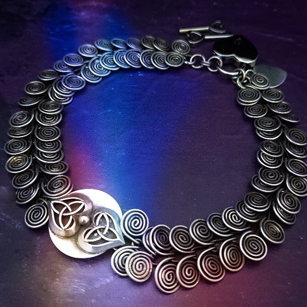 CELTIC HEARTS Submissive Locking Collar.  Every single link is handcrafted in sterling silver, then interlocked into the next link. This creates a very strong and substantial collar. You will love the weight and sensual feel of warm metal caressing the neck. Over 3 ounces of sterling. Can be worn locked or with a 'day clasp' for discretion. By My Secret Heart Studios