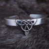 This traditional classic CELTIC DANCE cuff, adorned with a sterling Triquetra Knot, pays homage to the spirited nights of Celtic music and dancing. Its robust design ensures a lifetime of use, while the polished sterling silver offers a lustrous shine that never fades. This timeless piece of Celtic jewelry is sure to be a conversation starter.