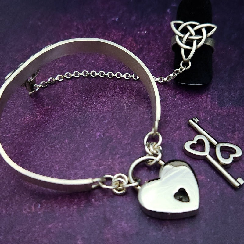 This traditional classic CELTIC DANCE cuff, adorned with a sterling Triquetra Knot, pays homage to the spirited nights of Celtic music and dancing. Its robust design ensures a lifetime of use, while the polished sterling silver offers a lustrous shine that never fades. This timeless piece of Celtic jewelry is sure to be a conversation starter.