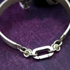 This traditional classic CELTIC DANCE cuff, adorned with a sterling Triquetra Knot, pays homage to the spirited nights of Celtic music and dancing. Its robust design ensures a lifetime of use, while the polished sterling silver offers a lustrous shine that never fades. This timeless piece of Celtic jewelry is sure to be a conversation starter.