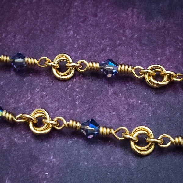 Adorn yourself with this beautiful handcrafted silver and crystal chain that can be transformed into stylish handcuffs and ankle restraints, a chic locking collar, or a decorative necklace for Dominants. Connect it to the back of a collar for a sexy look, and give a tug on the chain for an extra choking sensation. With its versatile appeal, CONVERSION CHAIN, BLACK ONYX & STERLING will certainly be a beloved accessory! By My Secret Heart Studios