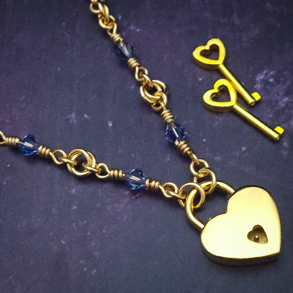 Adorn yourself with this beautiful handcrafted silver and crystal chain that can be transformed into stylish handcuffs and ankle restraints, a chic locking collar, or a decorative necklace for Dominants. Connect it to the back of a collar for a sexy look, and give a tug on the chain for an extra choking sensation. With its versatile appeal, CONVERSION CHAIN, BLACK ONYX & STERLING will certainly be a beloved accessory! By My Secret Heart Studios