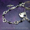 Adorn yourself with this beautiful handcrafted silver and onyx chain that can be transformed into stylish handcuffs and ankle restraints, a chic locking collar, or a decorative necklace for Dominants. Connect it to the back of a collar for a sexy look, and give a tug on the chain for an extra choking sensation. With its versatile appeal, CONVERSION CHAIN, BLACK ONYX & STERLING will certainly be a beloved accessory! By My Secret Heart Studios