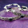 Adorn yourself with this beautiful handcrafted silver and onyx chain that can be transformed into stylish handcuffs and ankle restraints, a chic locking collar, or a decorative necklace for Dominants. Connect it to the back of a collar for a sexy look, and give a tug on the chain for an extra choking sensation. With its versatile appeal, CONVERSION CHAIN, BLACK ONYX & STERLING will certainly be a beloved accessory! By My Secret Heart Studios