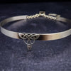 This BDSM Locking Submissive CELTIC DANCE collar is adorned with a sterling Triquetra Knot and pays homage to the spirited nights of Celtic music and dancing. Its robust design ensures a lifetime of use, while the polished sterling silver offers a lustrous shine that never fades. This timeless piece of Celtic jewelry is sure to be a conversation starter. By My Secret Heart Studios