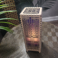 This striking DOMARA 11" LED lamp draws inspiration from Frank Lloyd Wright's iconic design philosophy, marrying contemporary lighting technology with artisanal craftsmanship. By Studio Navarri