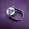ONE OF A KIND  Two in One Reversible Flip Ring  Change your mind. Change your mood. Completely handcrafted. The design spins, so just flip it around for a different look.  SIDE ONE: Sterling silver Celtic tryptic knot  SIDE TWO: Sterling Silver with Black Onyx set into filigree bezel. By My Secret Heart Studios