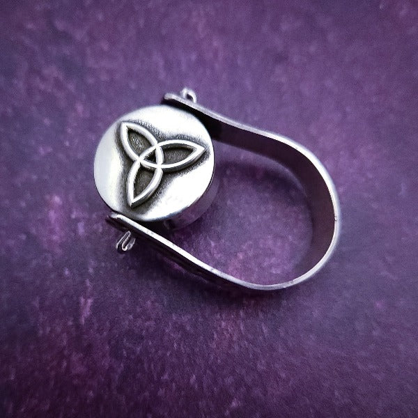 ONE OF A KIND  Two in One Reversible Flip Ring  Change your mind. Change your mood. Completely handcrafted. The design spins, so just flip it around for a different look.  SIDE ONE: Sterling silver Celtic tryptic knot  SIDE TWO: Sterling Silver with Black Onyx set into filigree bezel. By My Secret Heart Studios