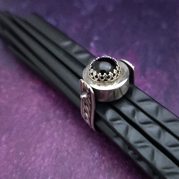 ONE OF A KIND  Two in One Reversible Flip Ring  Change your mind. Change your mood. Completely handcrafted. The design spins, so just flip it around for a different look.  SIDE ONE: Sterling silver Celtic tryptic knot  SIDE TWO: Sterling Silver with Black Onyx set into filigree bezel. By My Secret Heart Studios