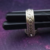 ONE OF A KIND  Two in One Reversible Flip Ring  Change your mind. Change your mood. Completely handcrafted. The design spins, so just flip it around for a different look.  SIDE ONE: Sterling silver Celtic tryptic knot  SIDE TWO: Sterling Silver with Black Onyx set into filigree bezel. By My Secret Heart Studios