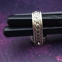 ONE OF A KIND  Two in One Reversible Flip Ring  Change your mind. Change your mood. Completely handcrafted. The design spins, so just flip it around for a different look.  SIDE ONE: Sterling silver Celtic tryptic knot  SIDE TWO: Sterling Silver with Black Onyx set into filigree bezel. By My Secret Heart Studios