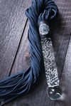 This limited edition Flogger, the Celtic Shield, is graced with a striking black and silver medallion full of mystic and heritage, showcasing a Celtic Shield and set with a Black Opal. For the 2023 holidays, only 7 of these have been created! Hurry and get yours now. Ready To Ship!