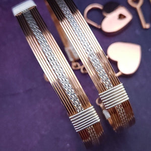 Our GODIVA bracelets are big, bold and dramatic, yet timeless and classic. Precious metals of Rose Gold and Sterling Silver embrace to create a seductive design that's big, bold and dramatic, yet is beautifully classic and timeless. Can be worn locked or with clasps for complete discretion. By My Secret Heart Studios