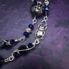 Crafted with My Secret Heart's exquisite and discreet grace, this one-of-a-kind design combines dark and creepy fashion with an air of submissive mystery. Decorated with sterling silver spiders and beetles, black onyx, and midnight Iris crystals, this exquisite locking kitten bell will surely make your kitten stand out.