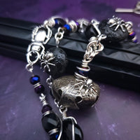 Crafted with My Secret Heart's exquisite and discreet grace, this one-of-a-kind design combines dark and creepy fashion with an air of submissive mystery. Decorated with sterling silver spiders and beetles, black onyx, and midnight Iris crystals, this exquisite locking kitten bell will surely make your kitten stand out.