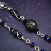 Crafted with My Secret Heart's exquisite and discreet grace, this one-of-a-kind design combines dark and creepy fashion with an air of submissive mystery. Decorated with sterling silver spiders and beetles, black onyx, and midnight Iris crystals, this exquisite locking kitten bell will surely make your kitten stand out.