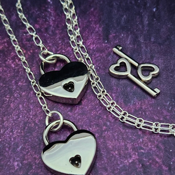 Transform this chain into a beautiful restraint for handcuffs or ankle bracelets, or wear it around the neck as a locking collar for submissives or a decorative chain necklace for Dominants. Oh... it can also be connected to the back of a collar and worn down the back. Super sexy!  Ohh... and a little tug on the chain with tighten that collar {think choke chain ;-} This versatile little piece is sure to be loved!
