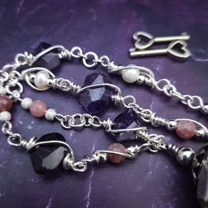 An original, one of a kind design, our locking submissive kitten bell is handcrafted with all the grace and discretion that My Secret Heart is known for. Wear this as a fashion piece or as a subtle submissive or pet play collar, either way you will look amazing!  Crafted in luxurious sterling silver and embellished with pretty pink Rhodochrosite, Amethyst nuggets, pearls and stardust beads, this will make your kitten feel so pretty! 