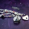 An original, one of a kind design, our locking submissive kitten bell is handcrafted with all the grace and discretion that My Secret Heart is known for. Wear this as a fashion piece or as a subtle submissive or pet play collar, either way you will look amazing!  Crafted in luxurious sterling silver and embellished with pretty pink Rhodochrosite, Amethyst nuggets, pearls and stardust beads, this will make your kitten feel so pretty!  By My Secret Heart Studios