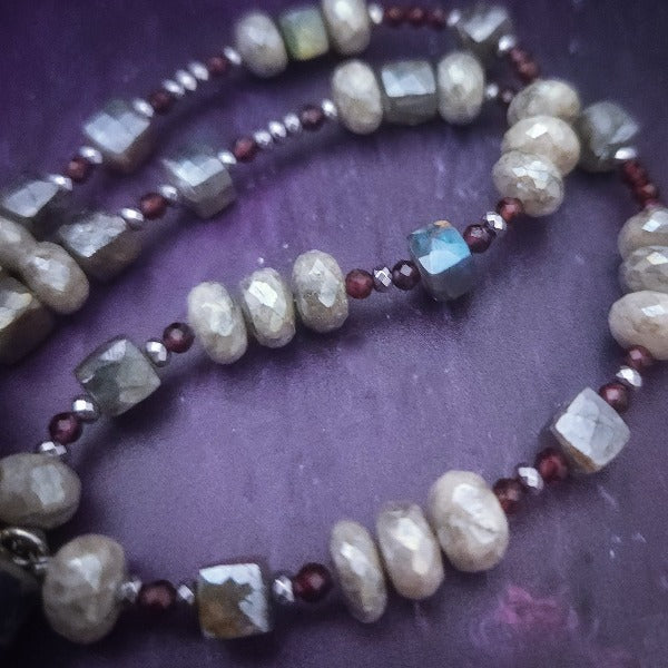 Rich Moonstone, Labradorite and Ruby glisten to give this piece a look of luxury, guaranteed to make your kitten purr with delight! An original, one of a kind design, our locking submissive kitten bell is handcrafted with all the grace and discretion that My Secret Heart is known for. Wear this as a fashion piece or as a subtle submissive or pet play collar, either way you will look amazing! 