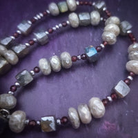 Rich Moonstone, Labradorite and Ruby glisten to give this piece a look of luxury, guaranteed to make your kitten purr with delight! An original, one of a kind design, our locking submissive kitten bell is handcrafted with all the grace and discretion that My Secret Heart is known for. Wear this as a fashion piece or as a subtle submissive or pet play collar, either way you will look amazing! 