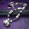 Rich Moonstone, Labradorite and Ruby glisten to give this piece a look of luxury, guaranteed to make your kitten purr with delight! An original, one of a kind design, our locking submissive kitten bell is handcrafted with all the grace and discretion that My Secret Heart is known for. Wear this as a fashion piece or as a subtle submissive or pet play collar, either way you will look amazing! 