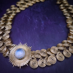The KYRO LOCKING SUBMISSIVE COLLAR is created to accommodate interchangeable medallions, which can be effortlessly changed.  In a heartbeat, you can transform from gothic to girly, uptown to downtown, or casual to dramatic. A collar so discreet, so unique in appearance, no one will ever guess that it's a statement of ownership. If they don't know, they will never guess, lol. This one features a Spiky Burst with Rainbow Moonstone. By My Secret Heart Studios