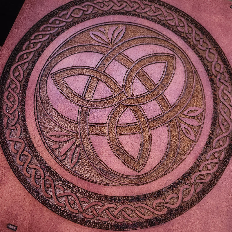 Decorative game with engraved celtic circles on a teak stain wood 
