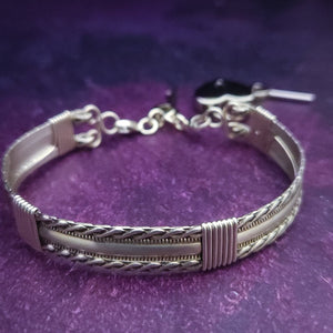 Bold, dramatic and luxurious, this KEY KEEPER BRACELETS is from our BABYLON COLLECTION. A detachable chain safely holds the key to Your submissive's lock.  Lobster clasps clip into rings attached to the cuff, which makes removing the chain and key simple. Never lose that all important, tiny key!  By My Secret Heart Studios