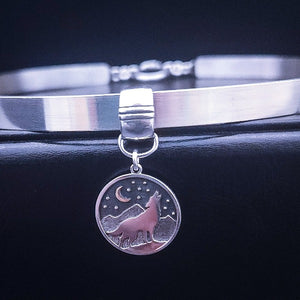 This Wolf Necklace can also be used as a collar slide to make a bold statement piece of Ownership. With a silhouette of a wolf howling in front of a crescent moon, against ablack starry sky and mountains, all sterling. The slide can easily be removed from the chain, and is compatible with *most* submissive collars. My Secret Heart Studios