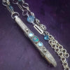 A BDSM gemstone necklace with a kinky secret. It holds a vibe! The ultimate luxury, this classic beauty pays homage to those dark, sensual moods London Blue Topaz and Aquamarines. One of a Kind design By My Secret Heart Studios