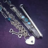 A BDSM gemstone necklace with a kinky secret. It holds a vibe! The ultimate luxury, this classic beauty pays homage to those dark, sensual moods London Blue Topaz and Aquamarines. One of a Kind design By My Secret Heart Studios