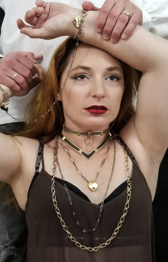 We've all fought battles. And won. I created Embrace to honor the battles. The handcrafted links are interlocked and symbolize the power of love and prayer. The power of loved ones and friends that stand by  you during your raging storms. Choose from a locking submissive style or traditional.