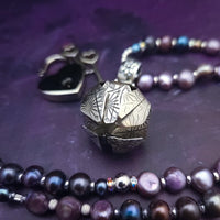 An original, one of a kind design, our locking submissive kitten bell is handcrafted with all the grace and discretion that My Secret Heart is known for. Wear this as a fashion piece or as a subtle submissive or pet play collar, either way you will look amazing!  Sumptuous fresh water pearls and sterling silver give this piece a luxurious finish, guaranteed to make your kitten purr with delight! By My Secret Heart Studios