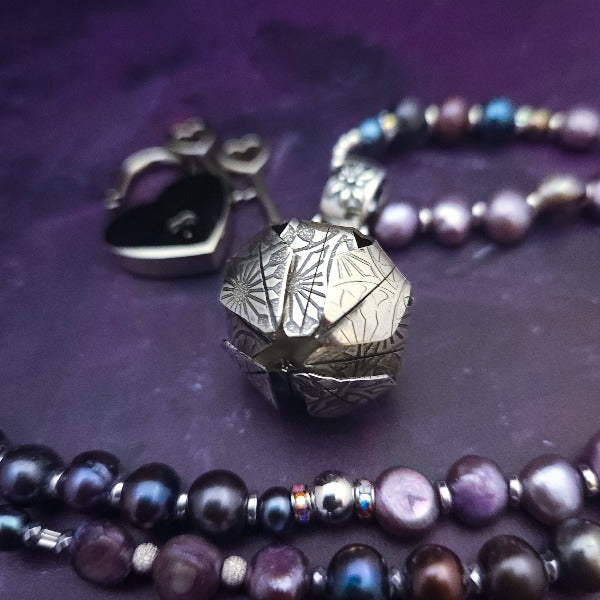 An original, one of a kind design, our locking submissive kitten bell is handcrafted with all the grace and discretion that My Secret Heart is known for. Wear this as a fashion piece or as a subtle submissive or pet play collar, either way you will look amazing!  Sumptuous fresh water pearls and sterling silver give this piece a luxurious finish, guaranteed to make your kitten purr with delight! By My Secret Heart Studios