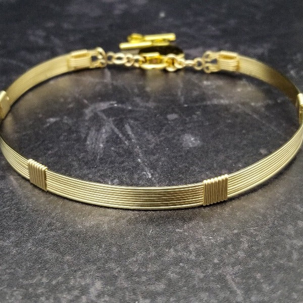 Our LODI Wire Wrapped Submissive Collars add a luxurious and seductive touch to your BDSM wardrobe. Handcrafted with 14K gold filled or sterling silver, these artisan collars lock shut for a secure and stylish look. Add luxury to your lifestyle with LODI by My Secret Heart Studios