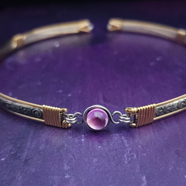 Our ‘WILD FLOWER’ collection speaks of rambling cottage gardens. Sensual and romantic. This artisan BDSM submissive jewelry is handcrafted in a floral pattern of sterling silver. The FLEXIBLE Wild Flower Locking BDSM Submissive Collar is made in two pieces, allowing it to be flexible instead of rigid. This romantic piece is Sterling Silver accented with 14k Gold Filled accents. 