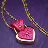 Revamp your locks with a touch of style. This locking soft chain collars features a small heart lock, adorned with a vibrant pink burst pattern and a sparkling center crystal. The embellished lock can also be worn with other collars and chains. Strut your ownership/submission in style ... never wear a plain ole' lock again!!