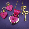 Revamp your locks with a touch of style. This locking soft chain collars features a small heart lock, adorned with a vibrant pink burst pattern and a sparkling center crystal. The embellished lock can also be worn with other collars and chains. Strut your ownership/submission in style ... never wear a plain ole' lock again!!