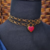 Revamp your locks with a touch of style. This locking soft chain collars features a small heart lock, adorned with a vibrant pink burst pattern and a sparkling center crystal. The embellished lock can also be worn with other collars and chains. Strut your ownership/submission in style ... never wear a plain ole' lock again!!