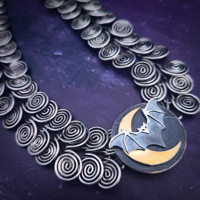 KYRO LOCKING SUBMISSIVE COLLARS are created to accommodate interchangeable medallions. In a heartbeat, you can transform from gothic to girly, or casual to dramatic. So discreet, so unique, no one will ever guess that it's a statement of ownership. Meticulously handcrafted.  Bat and Moon Medallion, sterling silver