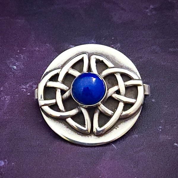 The KYRO INTERCHANGEABLE MEDALLIONS are created to wear on the KYRO COLLARS and can be effortlessly changed. In a heartbeat, you can transform a collar from gothic to girly, uptown to downtown, or casual to dramatic. Sterling Celtic Knot with Lapis. By My Secret Heart Studios.