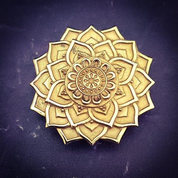 The KYRO INTERCHANGEABLE MEDALLIONS are created to wear on the KYRO COLLARS and can be effortlessly changed. In a heartbeat, you can transform a collar from gothic to girly, uptown to downtown, or casual to dramatic. This one is a bronze mandala flower. By My Secret Heart Studios