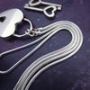 Sometimes sensual and provocative, sometimes mischievous and playful. And most times … just downright bratty, lol. A locking submissive kitten bell collar handcrafted and crafted with all the grace and discretion that My Secret Heart is known for.&nbsp;This artisan bell is hand-sawn from a sterling silver sheet, then torched, hammered, and domed into an exquisite bell. Your pet will make a delightful tinkle when you play.