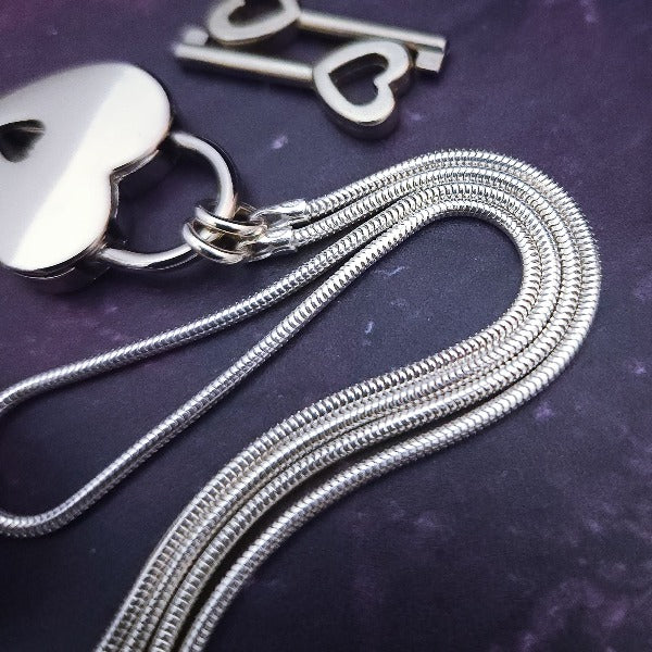 Sometimes sensual and provocative, sometimes mischievous and playful. And most times … just downright bratty, lol. A locking submissive kitten bell collar handcrafted and crafted with all the grace and discretion that My Secret Heart is known for.&nbsp;This artisan bell is hand-sawn from a sterling silver sheet, then torched, hammered, and domed into an exquisite bell. Your pet will make a delightful tinkle when you play.