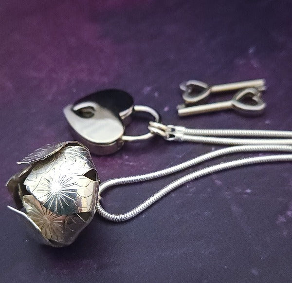 Sometimes sensual and provocative, sometimes mischievous and playful. And most times … just downright bratty, lol. A locking submissive kitten bell collar handcrafted and crafted with all the grace and discretion that My Secret Heart is known for.&nbsp;This artisan bell is hand-sawn from a sterling silver sheet, then torched, hammered, and domed into an exquisite bell. Your pet will make a delightful tinkle when you play.