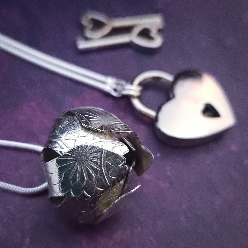 Sometimes sensual and provocative, sometimes mischievous and playful. And most times … just downright bratty, lol. A locking submissive kitten bell collar handcrafted and crafted with all the grace and discretion that My Secret Heart is known for.&nbsp;This artisan bell is hand-sawn from a sterling silver sheet, then torched, hammered, and domed into an exquisite bell. Your pet will make a delightful tinkle when you play.
