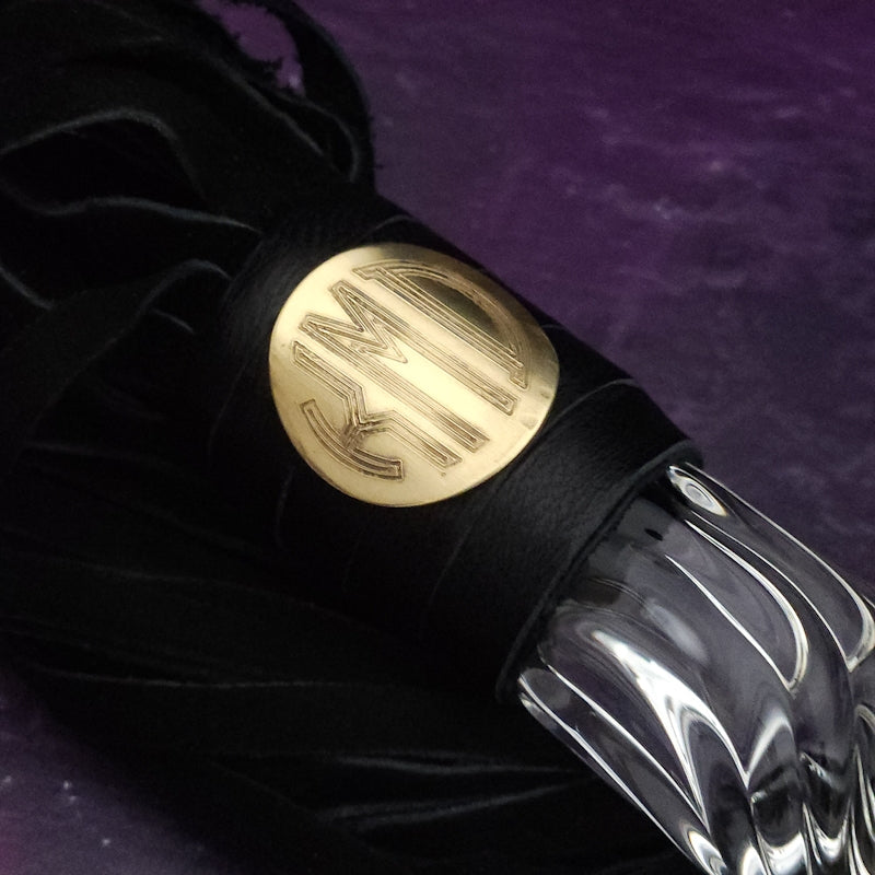 Experience the perfect balance of pleasure and pain with this BDSM Flogger in Black Leather and Glass! Stylish, luxurious, and crafted with great care, it's the classic impact toy of your kinky dreams. Personalize to your heart's content - heat it up or hit it hard - and explore a range of sensations with S&M play! Can be Monogrammed / Engraved. By My Secret Heart Studios
